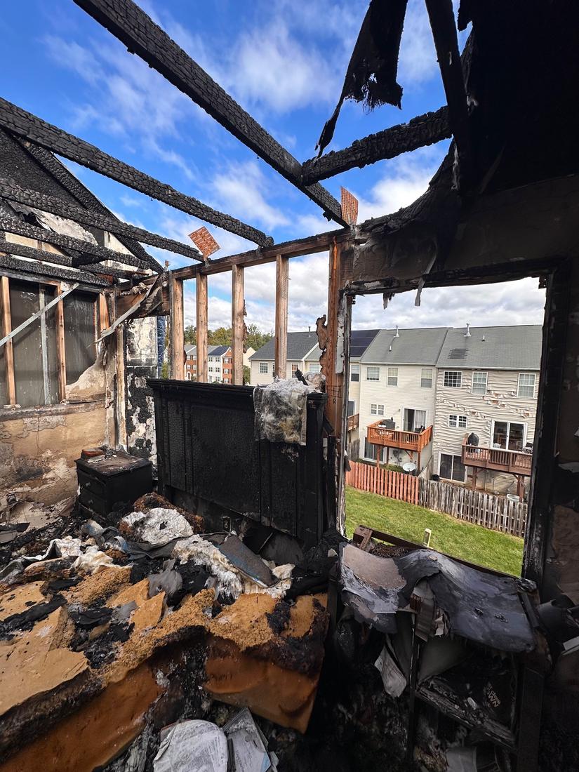 Fire-damaged room opened to the sky, ready for rebuild planning