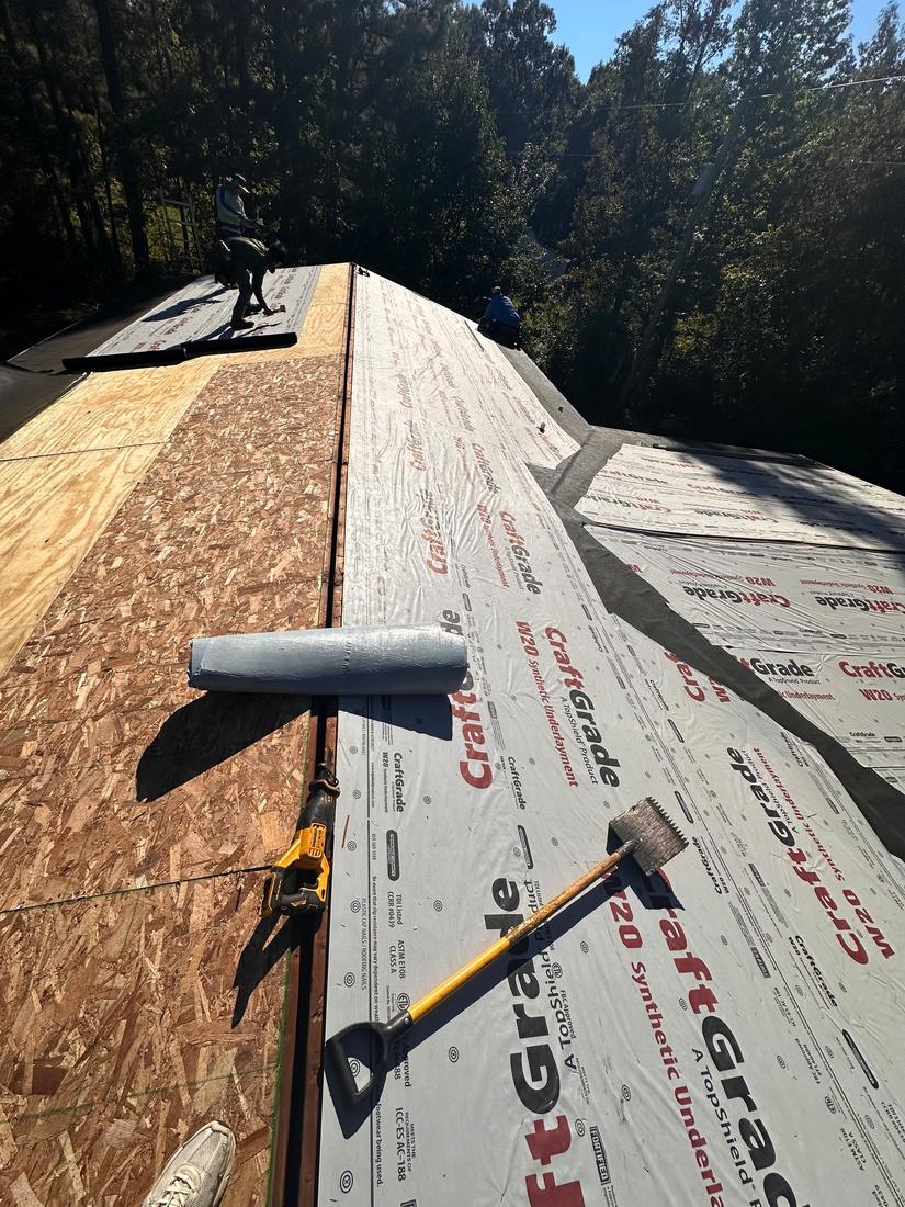 Underlayment installation on a new roof deck