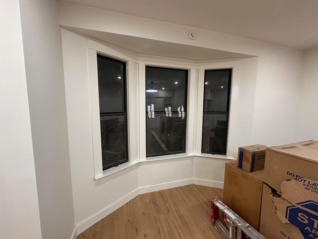 Bay window with new trim, paint, and flooring