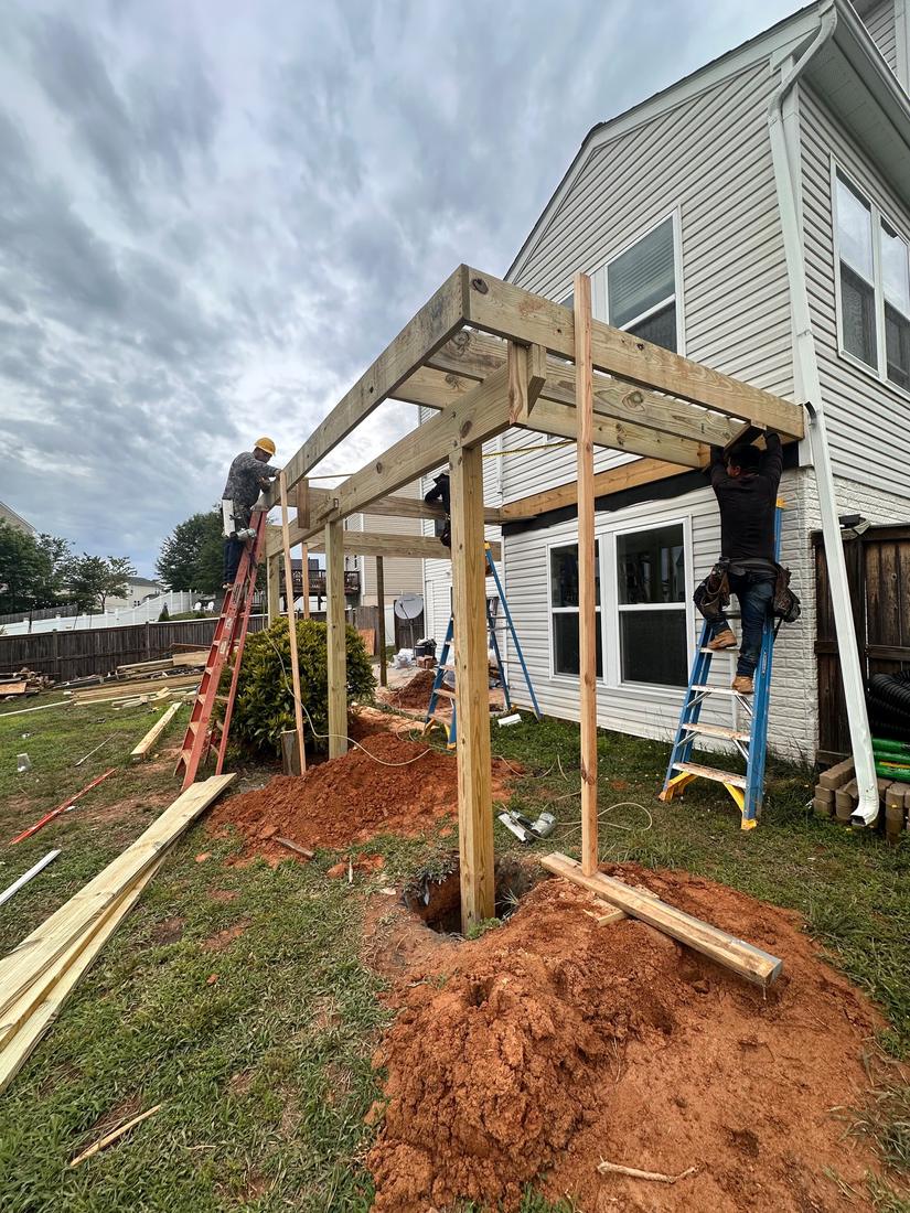 Crew building a covered deck structure