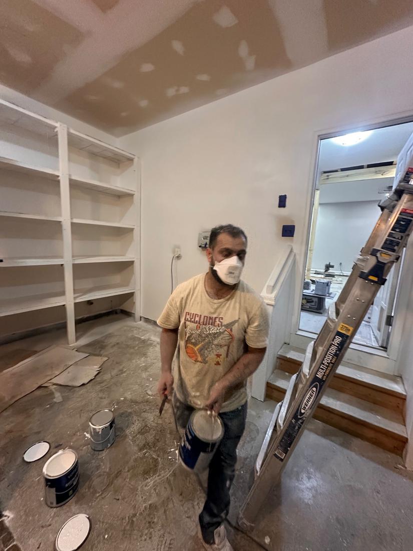 Drywall finishing, painting, and built-in shelving