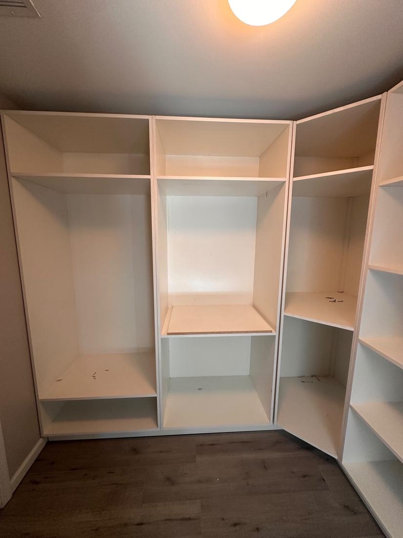Closet cabinetry with hanging and shelf sections