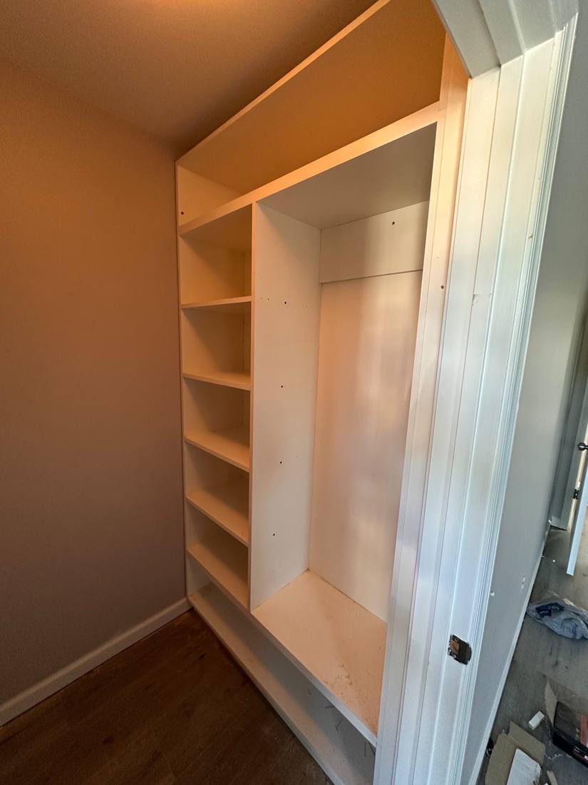 Custom closet built-ins with shelves and hanging space