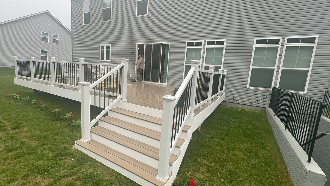 Deck stairs with composite treads and matching railing