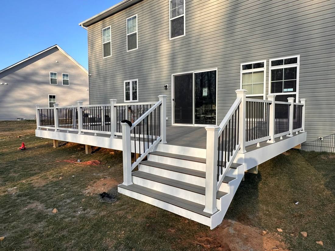 Completed deck with wide stairs and railing