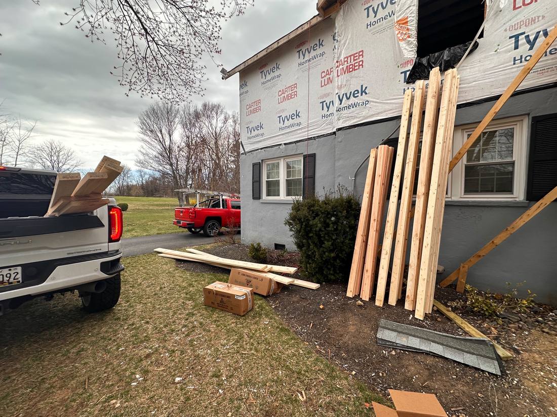 Second-story addition: house wrap on and framing lumber delivered