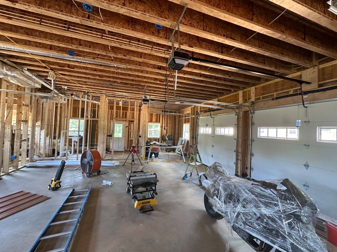 Garage build-out with framing, plumbing, and electrical rough-in
