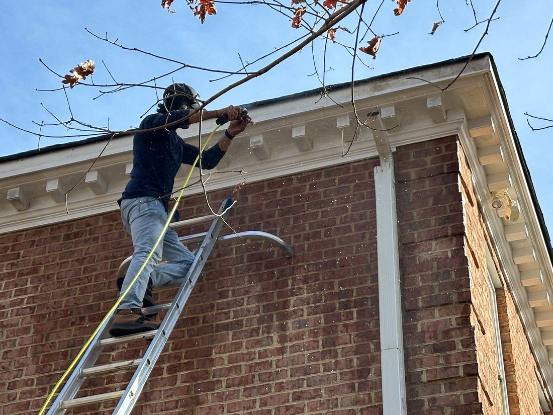 Exterior trim and gutter work from a ladder